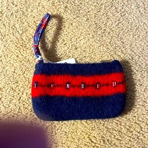 Wool handmade purse with cotton stars lining! 
Big enough for keys, phone etc.